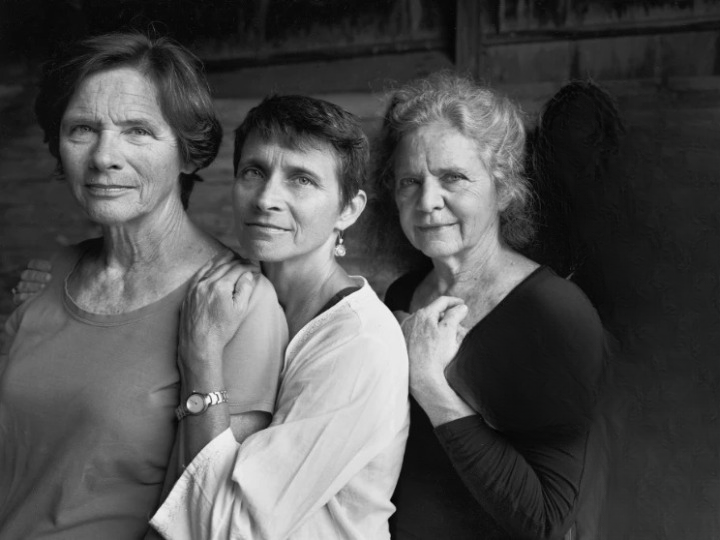 Identical triplets take the same birthday picture for 33 years