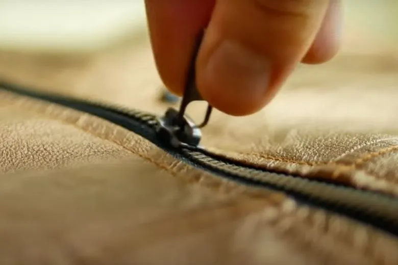 A boy fished an old bag out of the water, looked inside, and ended up calling the police