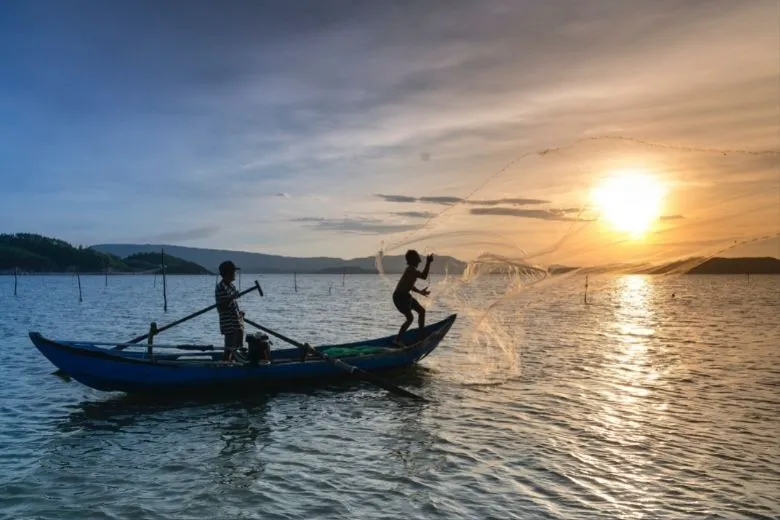 A boy fished an old bag out of the water, looked inside, and ended up calling the police