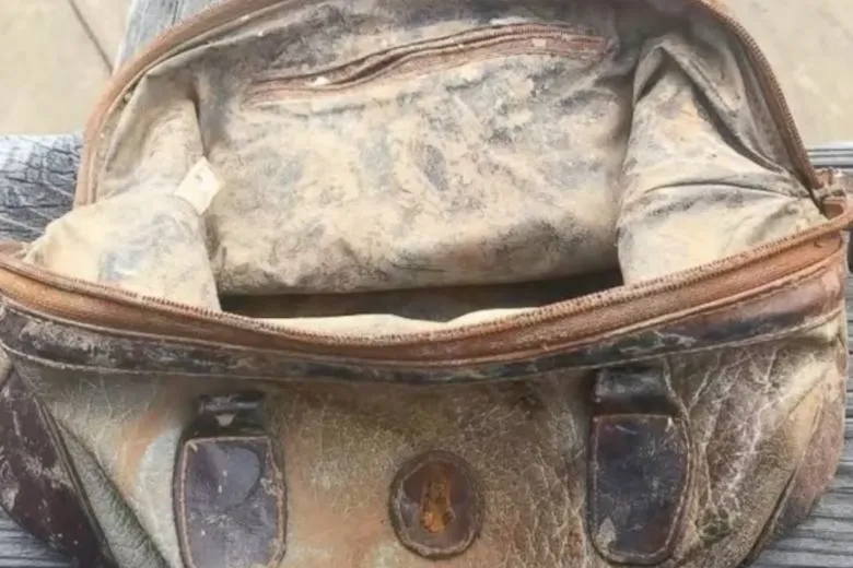 A boy fished an old bag out of the water, looked inside, and ended up calling the police