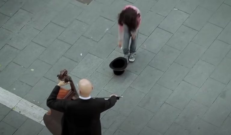 This street musician was ignored by everybody, but then a little girl changed everything